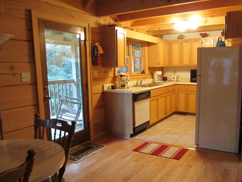 Cable TV, Hot tub, trash pick up, Two queen-size beds includes linens, bathroom shower/tub & two sinks, hairdryer, towels & wash clothes, kitchen includes range, refrigerator, microwave, toaster, coffeemaker | Highland Glade Cabin Rentals | Gatlinburg, TN